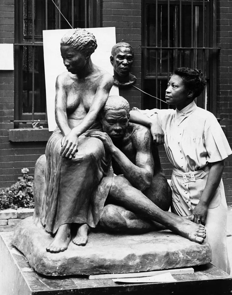 Sculptor Augusta Savage with her work in Harlem, photographed for a Federal Art Project record