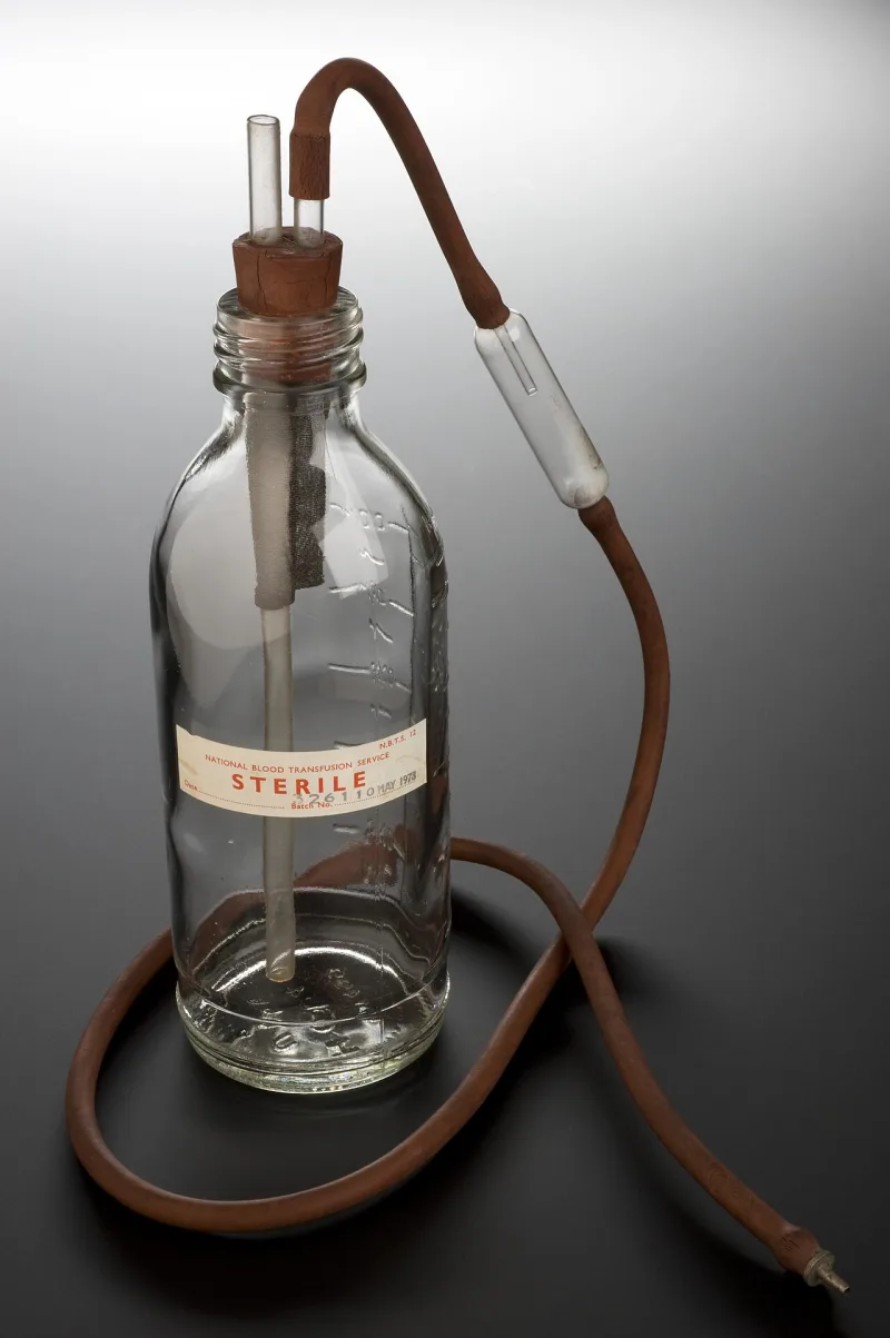 An early blood transfusion bottle and its fittings, the treatment these young people refused