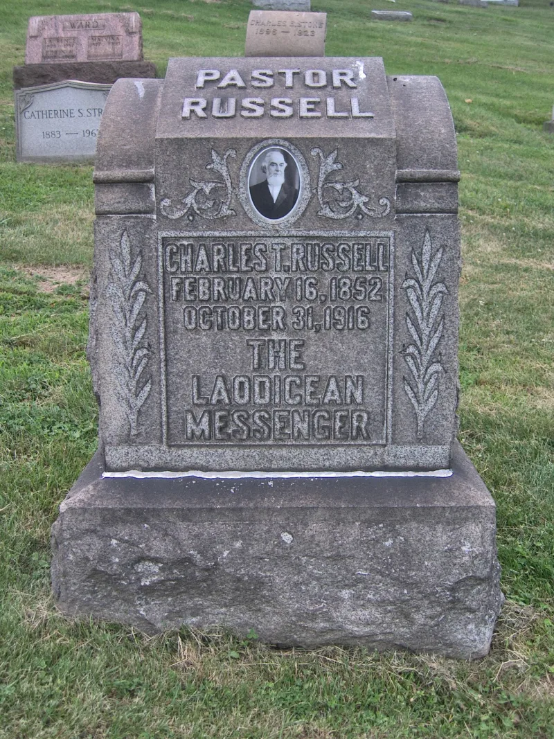 Russell's own grave marker in the same cemetery, a short distance from the pyramid