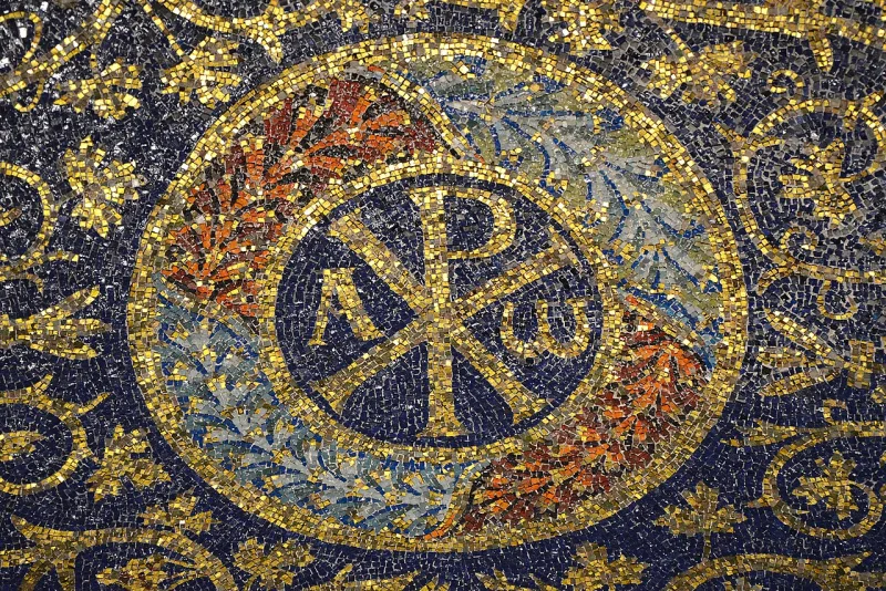 A Chi-Rho mosaic at Ravenna, AD 425 — a Christian monogram built from Greek letters
