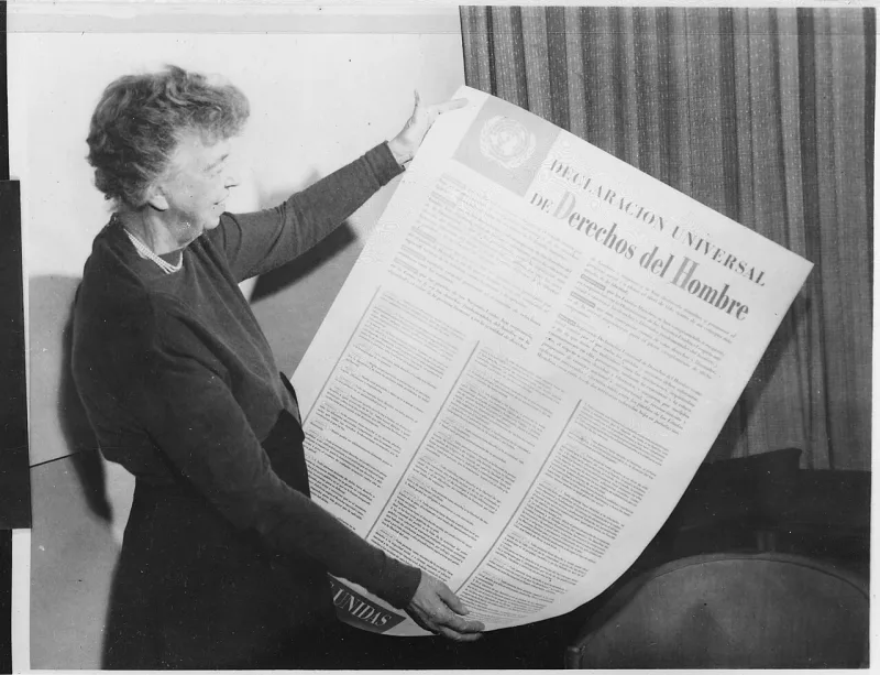Eleanor Roosevelt holding a Spanish text of the Universal Declaration of Human Rights, 1949