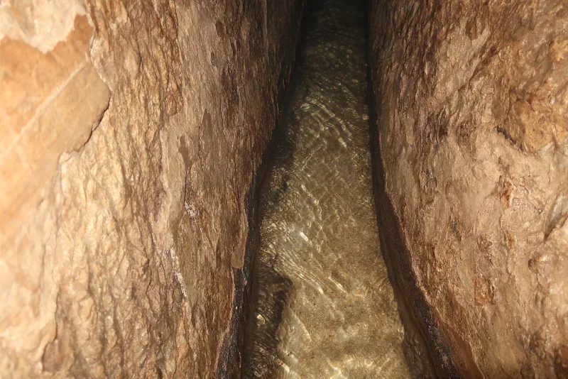Inside Hezekiah's tunnel beneath Jerusalem, still carrying water along its hand-cut rock channel