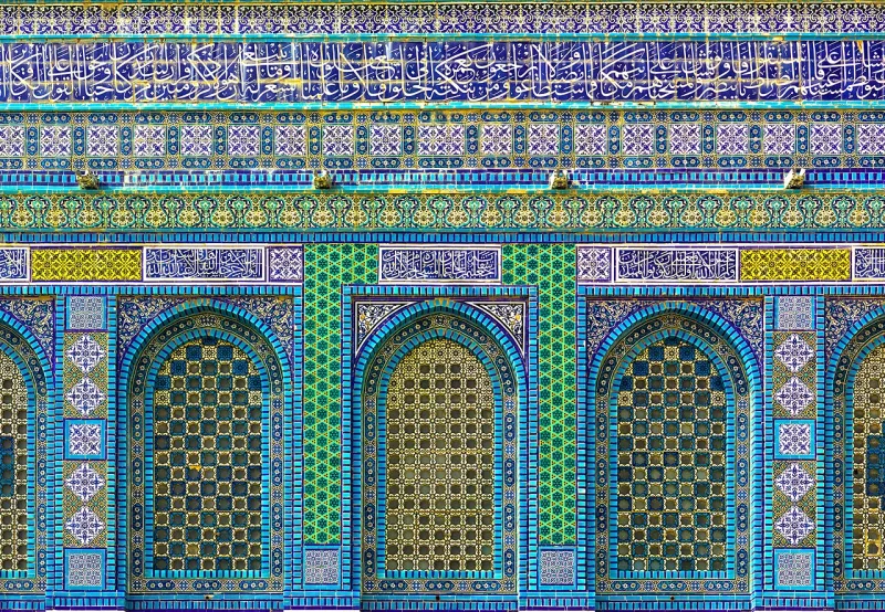 The Dome of the Rock, finished 691, whose mosaic band quotes the Qur'an in dated stone
