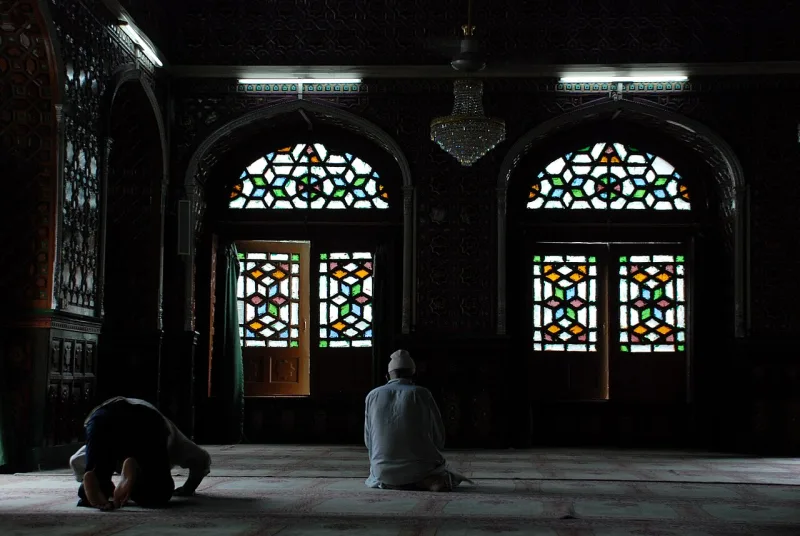 Worshippers at prayer in Srinagar; the deeds being weighed are the ordinary acts of observance