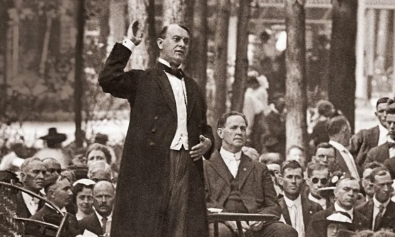 Rutherford addressing an audience in 1919; the Society dates its commission to that year