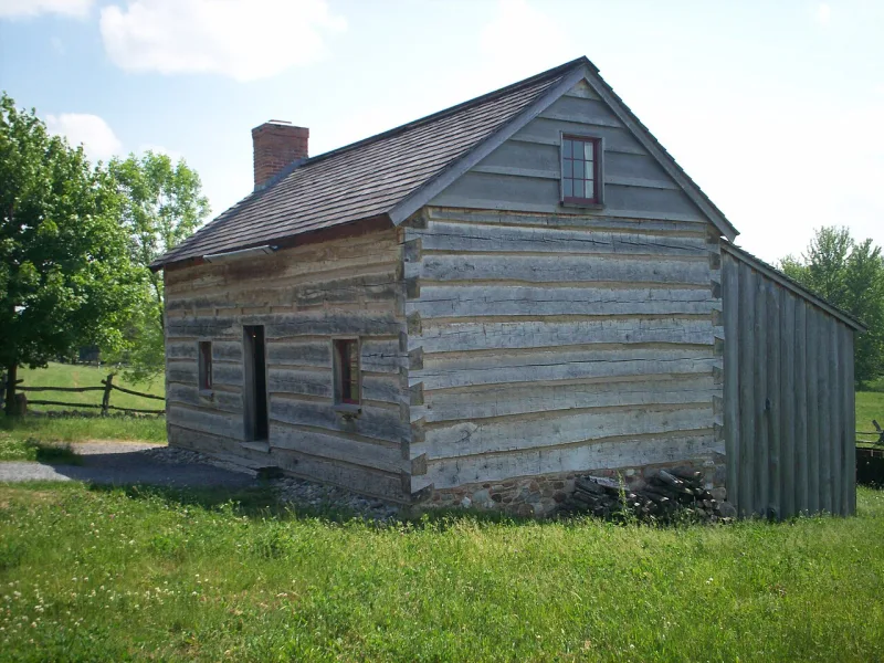 A reconstruction of the Smith family log home at Palmyra, from Smith's treasure-seeking years