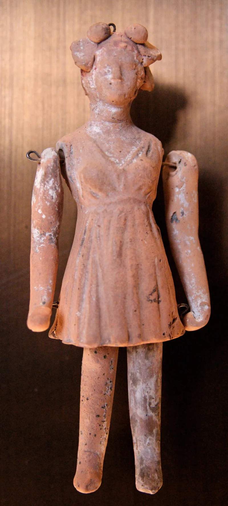 An ancient terracotta doll in the Louvre — a comparable toy, not one of Aisha's