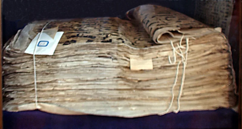 An early Kufic Qur'an; the text names Allah as creator of sun and moon alike, not as either